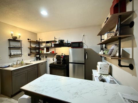 This small kitchen has everything you need to cook-in during your stay.