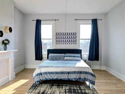 This king-sized bedroom offers the perfect retreat for relaxation and comfort.
