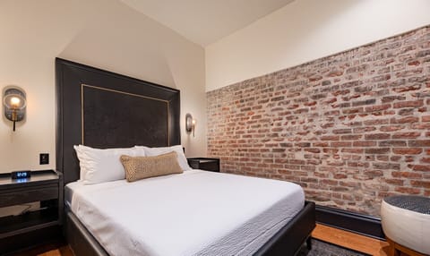 Bedroom 1 - Queen bed featuring a built-in wardrobe and flat-screen TV.