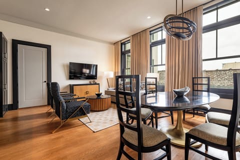Bright and open living area with elegant furnishings and natural light, creating a welcoming and airy space.