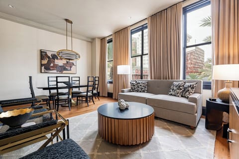 Sophisticated living area with expansive Canal Street views, highlighted by tall windows that bring in plenty of light and capture the city's energy.
