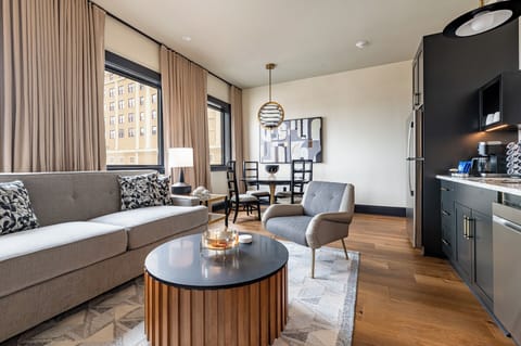 Chic and comfortable penthouse living room with statement decor filled with natural light.