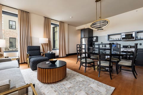 Living room 1 - Spacious living and dining area featuring soft neutral tones and an abundance of natural light, offering a relaxing and welcoming atmosphere.