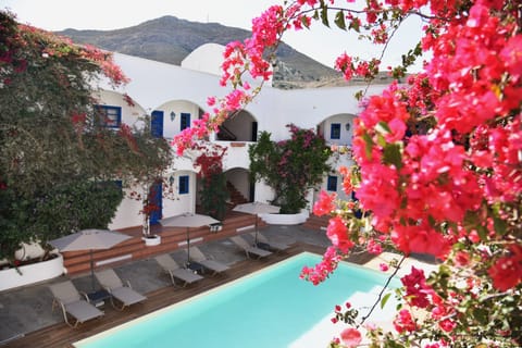 Outdoor pool, a rooftop pool, pool umbrellas, sun loungers
