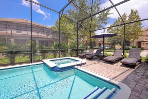 Lounge by the pool or soak in the bubbling spa, all surrounded by lush greenery.