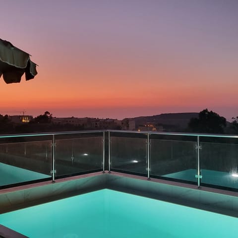 Seasonal outdoor pool, open 9:30 AM to 9:00 PM, pool umbrellas