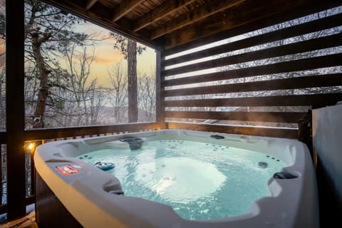 Slide into the hot tub right as the sky turns orange behind the trees. Steam rising, string lights coming on, nowhere you need to be for the next hour.