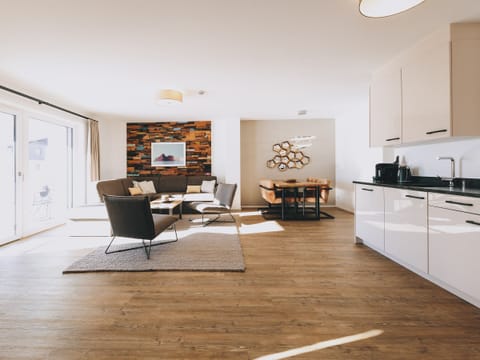 Living area in the holiday flat Apartments Goldbergblick by We Rent in Rauris.