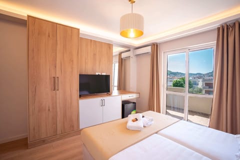 Deluxe Double Room, Balcony, City View | Memory foam beds, in-room safe, soundproofing, iron/ironing board