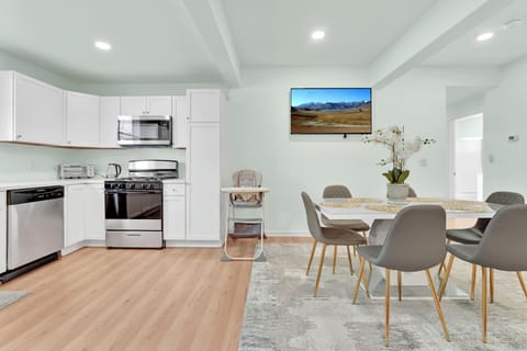 Fully stocked Kitchen. 6 seating Dining table,  with high chair for little one.
