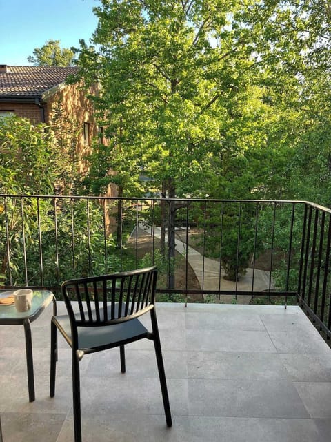 Chill balcony overlooking complex garden.