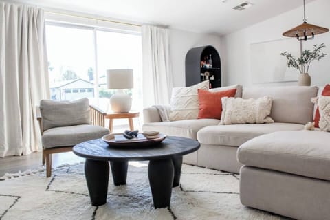 Comfortable seating centered around the TV and coffee table, ideal for socializing and unwinding!
