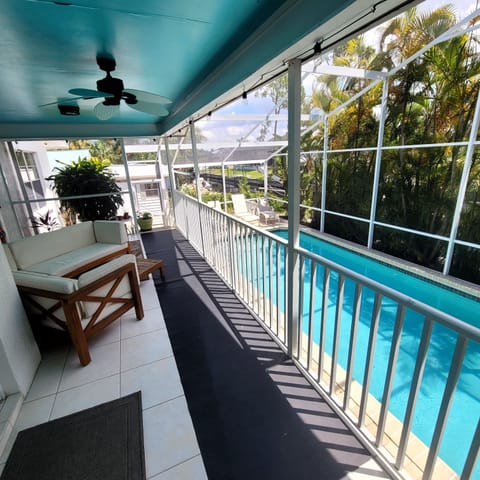 Back covered lanai and pool area. 12x30 Saltwater Pool.