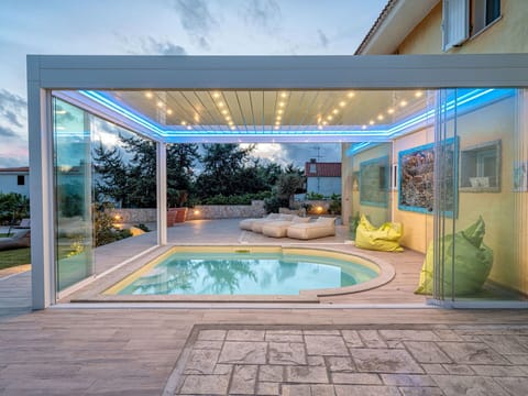 Water, Property, Plant, Building, Azure, Swimming Pool, Sky, Shade, Interior Design, Residential Area