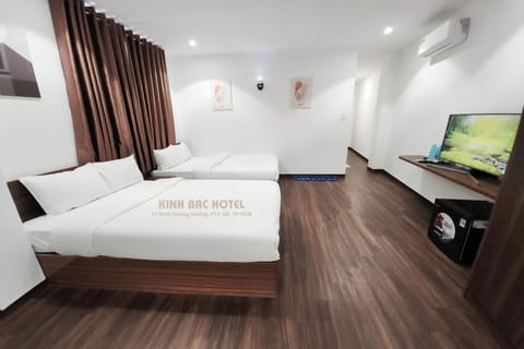 Deluxe Quadruple Room, Private Bathroom, City View | Blackout drapes, free WiFi, bed sheets