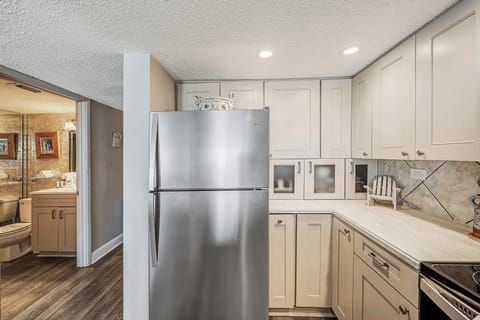 The fully equipped kitchen features updated cabinetry, stainless-steel appliances, granite countertops, and has everything you need to prepare meals for family & friends.