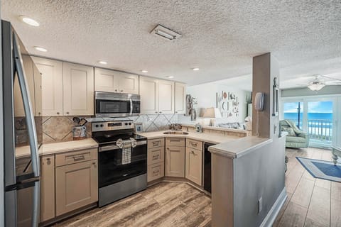 The fully equipped kitchen features updated cabinetry, stainless-steel appliances, granite countertops, and has everything you need to prepare meals for family & friends.