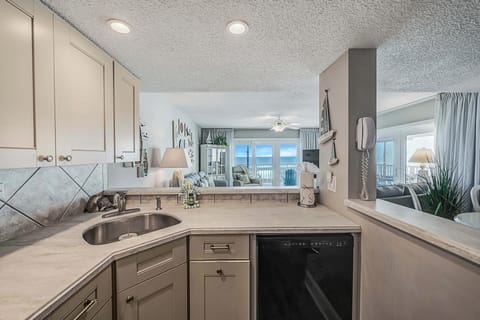 The fully equipped kitchen features updated cabinetry, stainless-steel appliances, granite countertops, and has everything you need to prepare meals for family & friends.