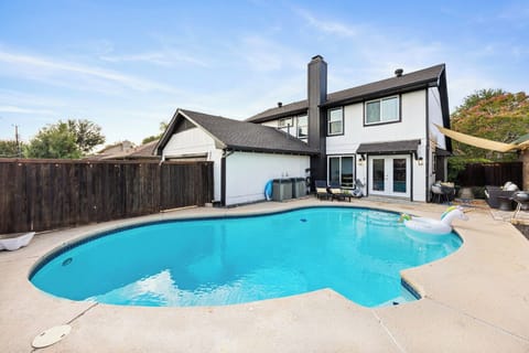 Fully fenced pool with bbq and shaded outdoor seating - perfect for family fun