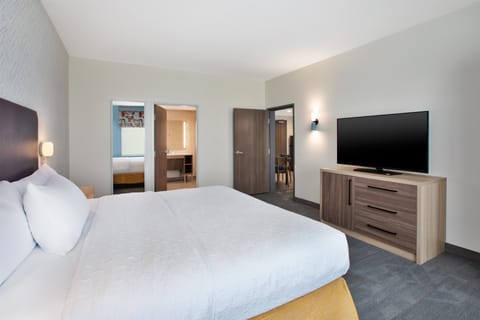 Suite, 1 King Bed, Accessible Bathtub | Desk, laptop workspace, blackout drapes, iron/ironing board