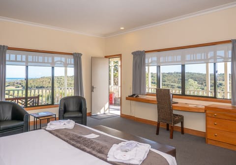 Premium bedding, desk, laptop workspace, blackout drapes