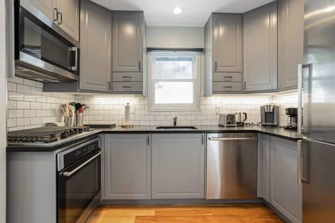 Newly Renovated Kitchen features Gas Range, Microwave, Dishwasher and fully stocked for your cooking needs.