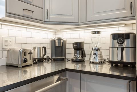Kitchen features Keurig Coffee Maker, Drip Coffee Maker, Blender, Air Fryer, Electric Tea Kettle and Toaster.