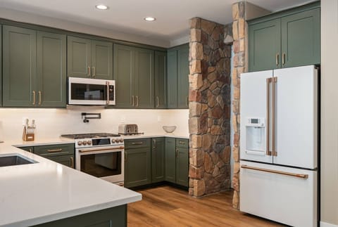 The kitchen is stocked with a robust supply of pots, pans, and appliances.