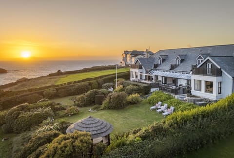 Welcome to Henscath House, an exquisite family retreat perched atop the breathtaking Mullion Cove