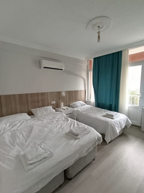 Family Room, Multiple Bedrooms, Balcony, City View | Laptop workspace, WiFi (free), bed sheets