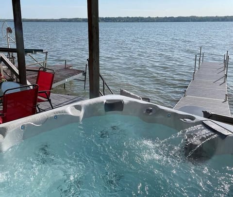 Immerse yourself in pure relaxation with our stunning lakefront hot tub. Nestled at the edge of the water, this outdoor haven offers sweeping views of the serene lake and surrounding nature.