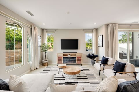 Relax in this stylish living area with plenty of seating for everyone.