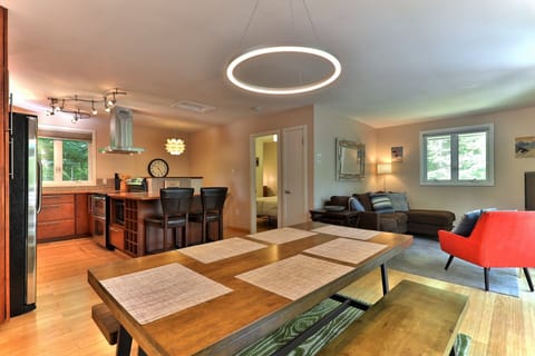 One of two living areas in this chic retreat just off the main road in Killington, VT. Open kitchen with stainless appliances, ample space for relaxation and entertainment, high-speed WiFi and streaming services.