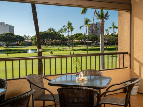 Delight in al fresco dining on your private balcony with serene views of palm trees and the lush golf course.