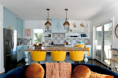 Large kitchen island doubles as dining space and gathering spot.