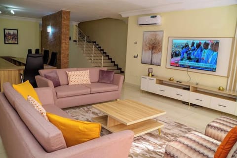 Deluxe Room, Balcony, City View | Living area | TV