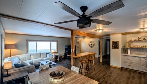 Kitchen, dining, bar/island and living room all connect in this open concept space.