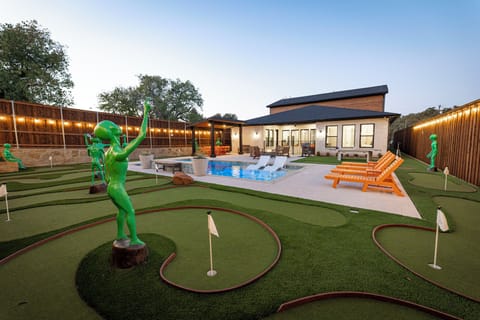 Private backyard with pool, spa, and mini golf — relax after stadium events.