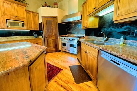 Cook gourmet meals in the fully equipped kitchen, then enjoy them in the elegant dining area with mountain charm.