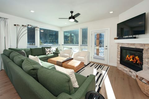 The main living area is flooded with natural light thanks to large windows and features access to two separate balconies.
