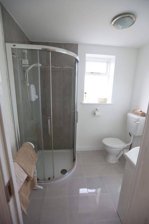 Clean, fresh bathroom with shower.