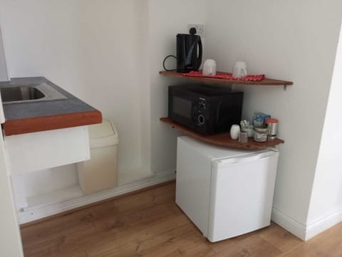 Mini fridge, microwave, tea and coffee making facilities.