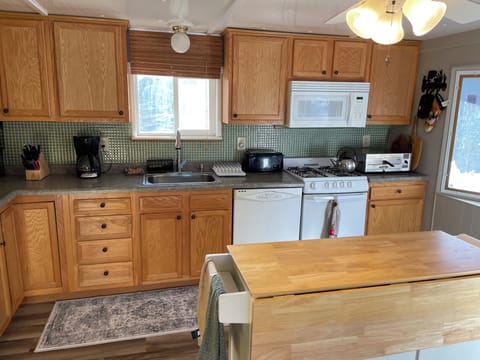 Fully stocked kitchen, with dishwasher, pizza oven and all your cooking needs.