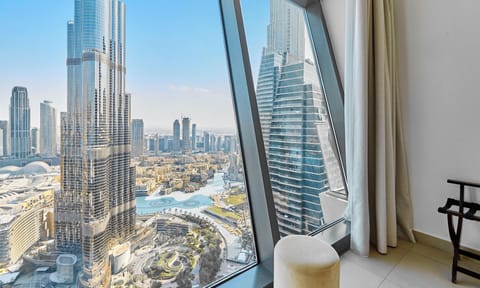 Deluxe Apartment | Living area | 55-inch flat-screen TV with digital channels