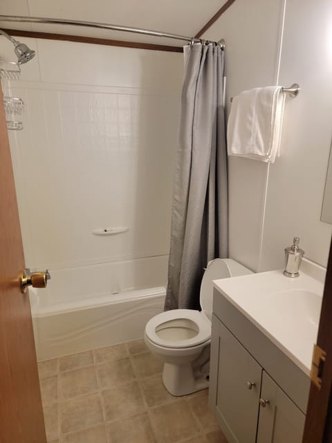 Toilet paper soap towels wash rags hair drive all provided