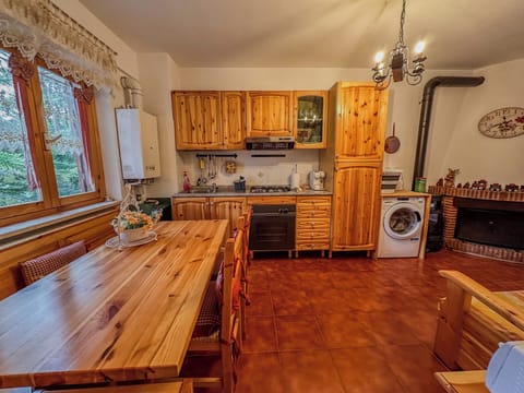 Apartment, Balcony, Garden View | Private kitchen | Electric kettle, dining tables