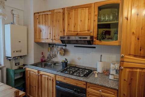 Apartment, Balcony, Garden View | Private kitchen | Electric kettle, dining tables