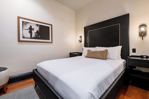 Bedroom 1 - Queen bed featuring a built-in wardrobe and flat-screen TV.