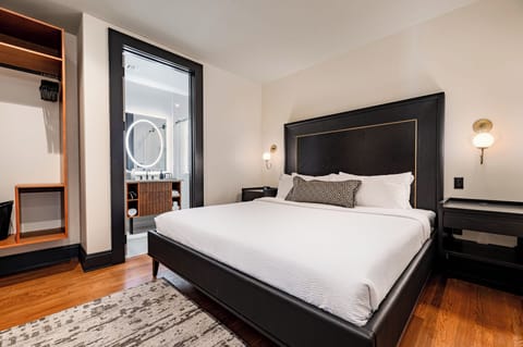 Bedroom 1 - King bed featuring a built-in wardrobe, flat-screen TV, and en-suite bathroom.