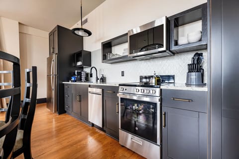 Fully equipped kitchen with modern appliances, offering everything you need for preparing meals or enjoying a morning coffee.